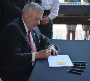 Governor Nathan Deal signing Senate Bill 136 on April 23, 2013. ~~ Photograph by Robert Sutherland