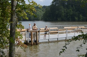 Rick Hamby of Cleveland, Georgia, took Cody & Micah Hanson fishing on the fancy pier at Don Carter State Park on opening day. ~~ Photograph by Robert Sutherland