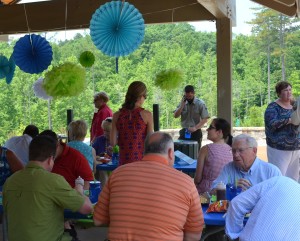 Guests -- including Don Carter (lower right in the blue shirt) at the 2014 Lake Lanier Convention & Visitors Bureau Annual Meeting ~~ Photograph by Robert Sutherland